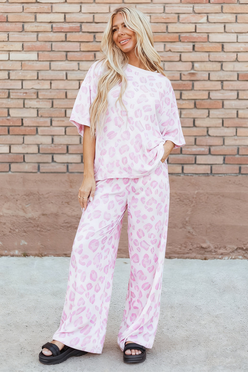 Pink leopard print two-piece top and pants set by Dear-Lover, made of polyester and elastane, stylish and comfortable.