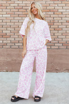 Pink leopard print two-piece top and pants set by Dear-Lover, made of polyester and elastane, stylish and comfortable.