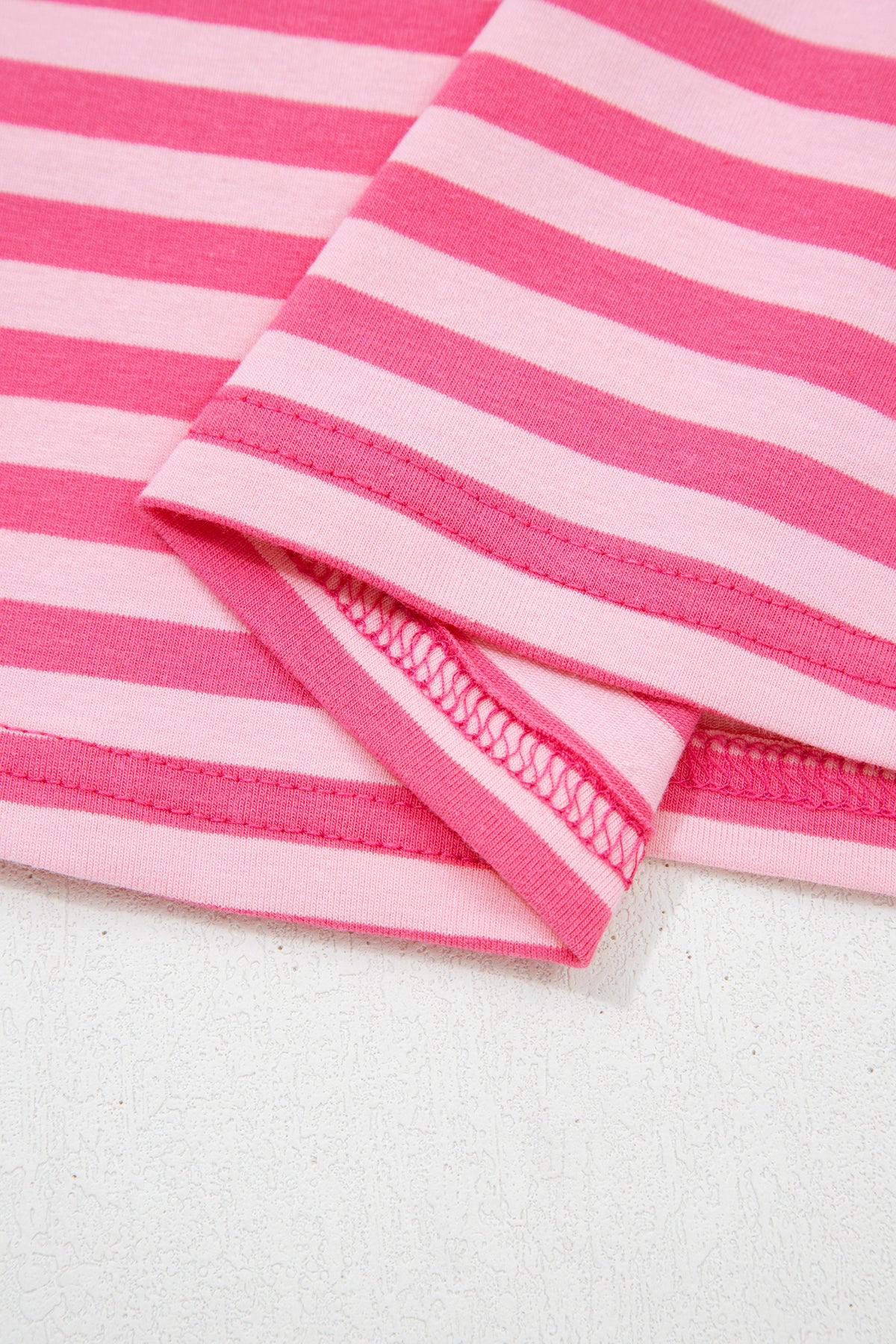 Pink stripe two-piece set with drop shoulder round neck top and buttoned straight pants from Dear-Lover, made of cotton and elastane.