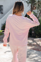 Pink stripe two-piece set with a drop shoulder round neck top and buttoned straight pants, made of cotton and elastane.