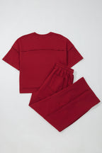 Racing red drop shoulder boxy tee and barrel pants set by Dear-Lover, featuring a stylish two-piece polyester-cotton casual outfit.