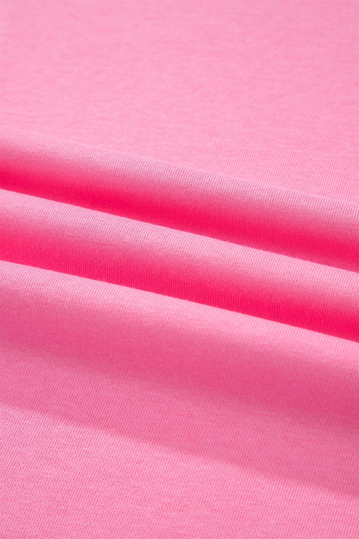 Pink solid oversized tee with pocket and casual pants, part of Dear-Lover two-piece set, made from cotton and polyester fabric.