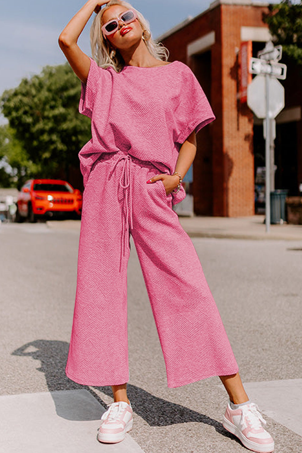 Strawberry pink textured loose fit T-shirt and drawstring pants set from Dear-Lover, casual two-piece outfit for women.