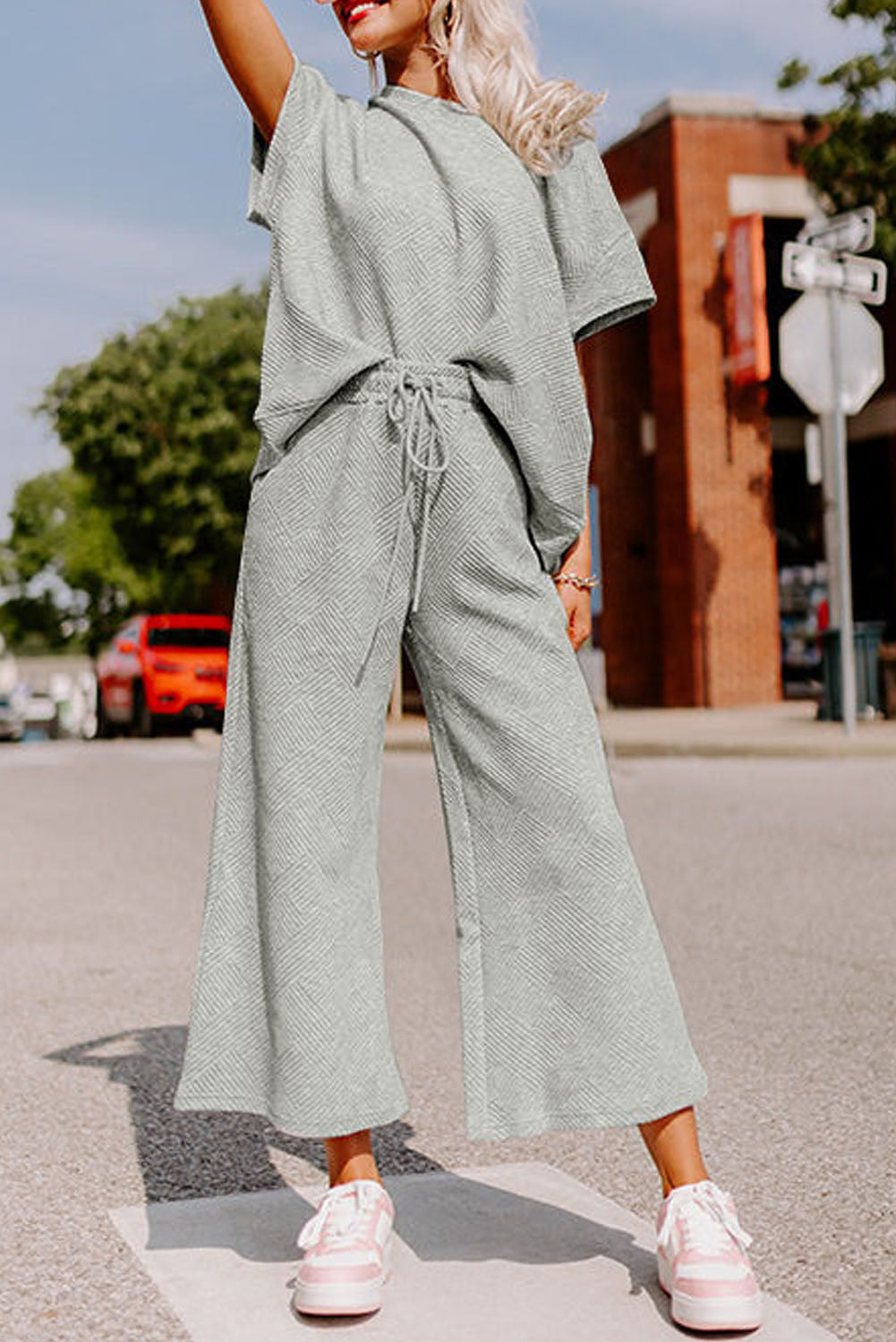 Strawberry pink textured loose fit T-shirt and drawstring pants set by Dear-Lover, casual two-piece polyester-elastane outfit.