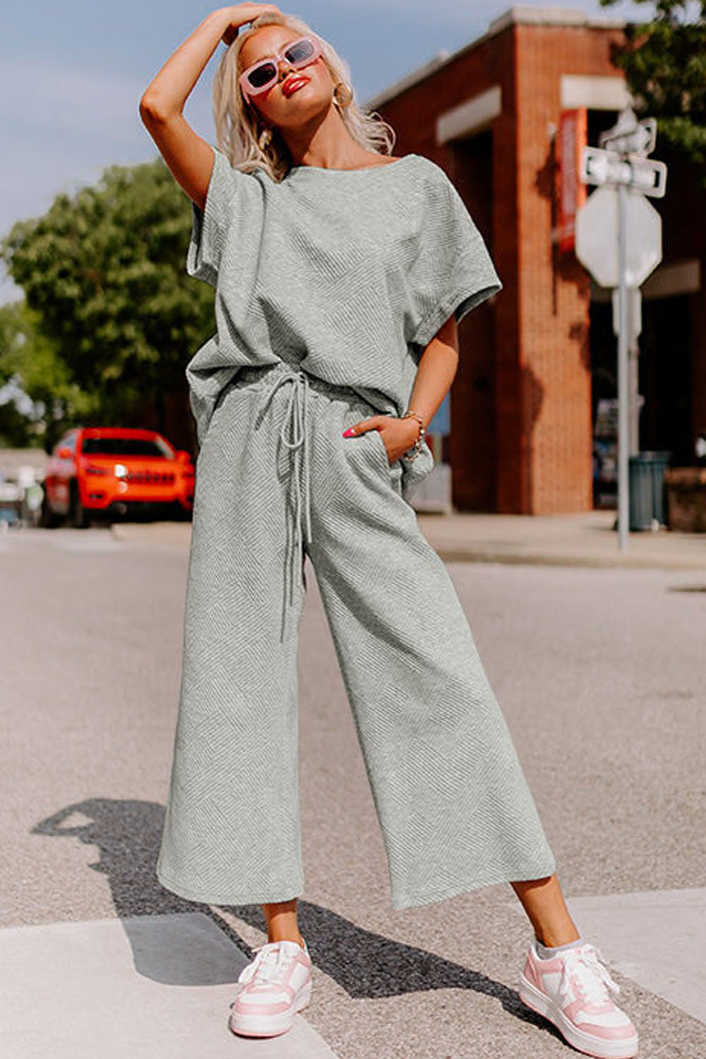 Strawberry pink textured loose fit T-shirt and drawstring pants set by Dear-Lover, casual two-piece outfit with comfortable fit.
