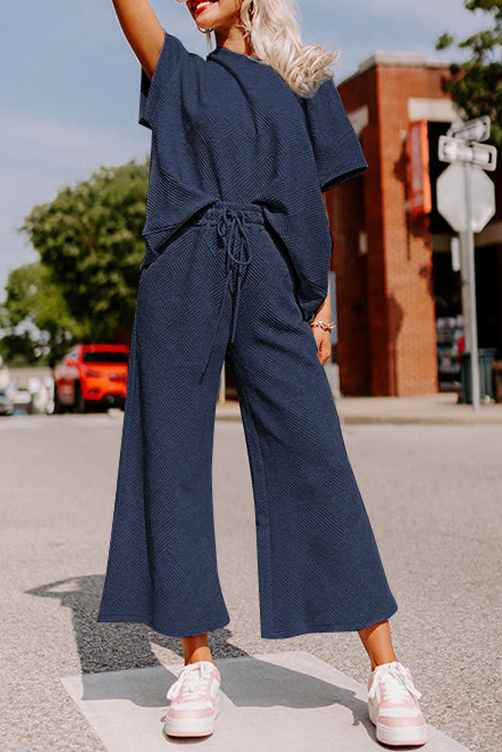 Strawberry pink textured loose fit T-shirt and drawstring pants set from Dear-Lover Dropshipping, casual two-piece outfit.