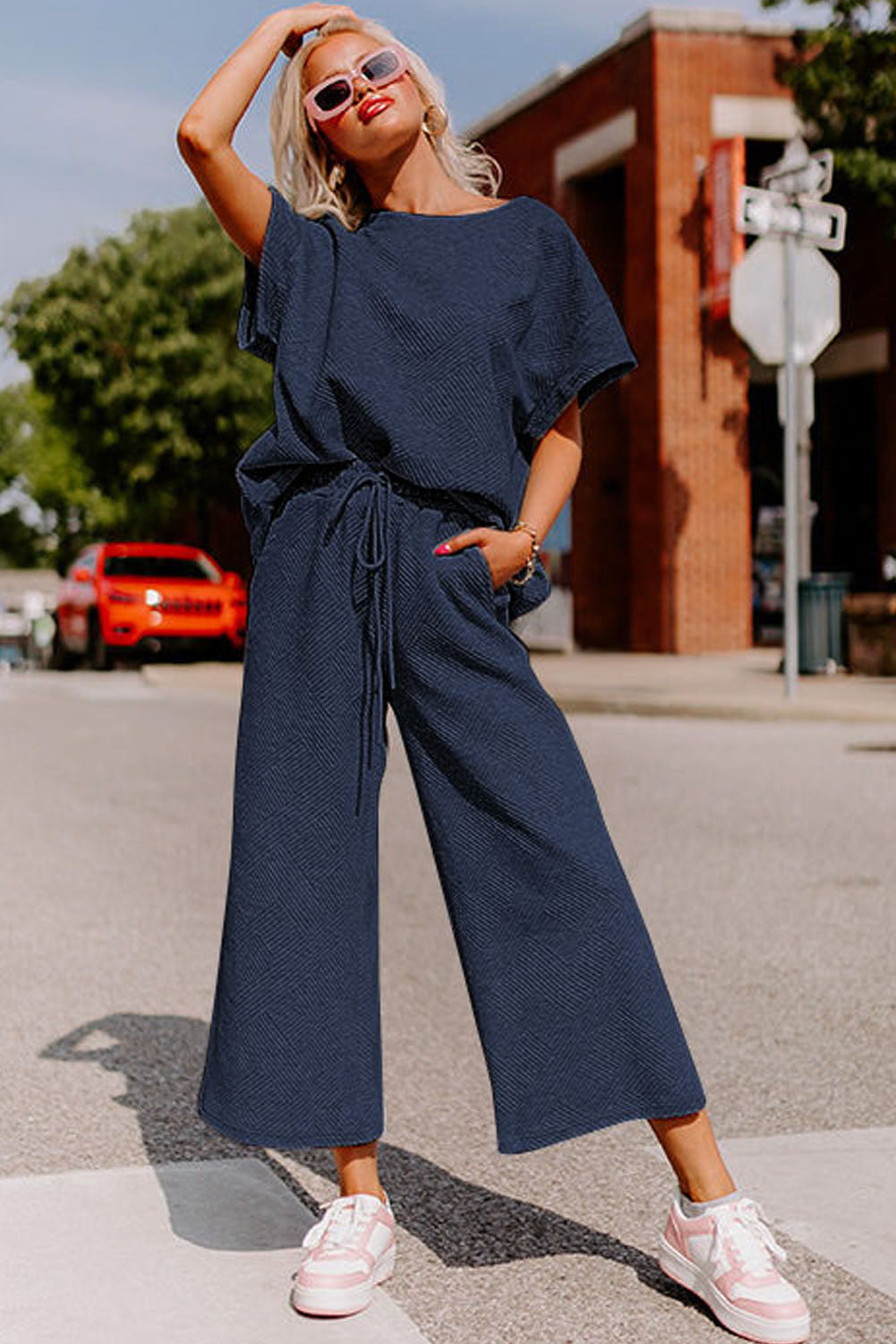 Strawberry pink textured loose fit T-shirt and drawstring pants set by Dear-Lover, casual two-piece outfit for women.