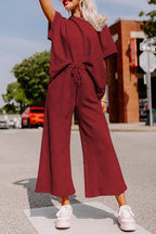 Strawberry pink textured loose-fit T-shirt and drawstring pants set by Dear-Lover, casual two-piece polyester-elastane ensemble.