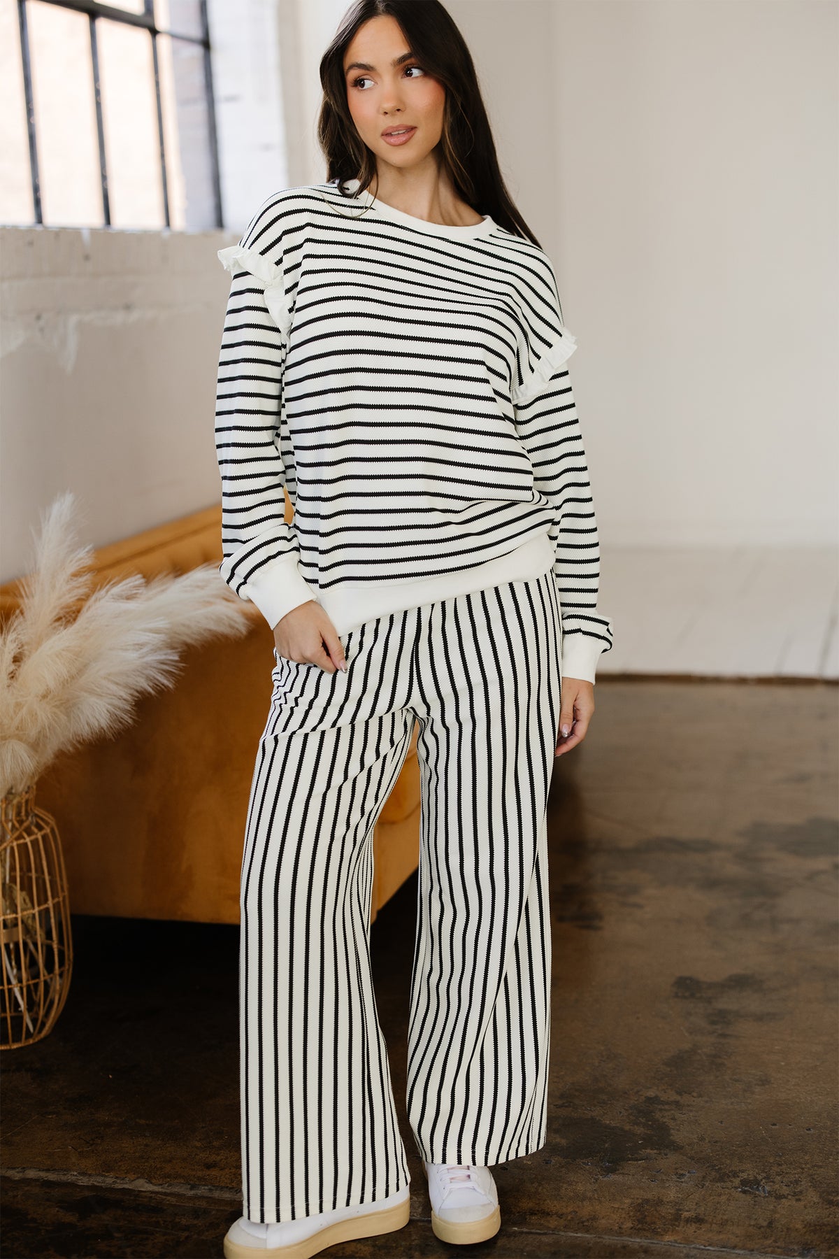 White stripe ruffle trim drop shoulder top and loose drawstring pant set by Dear-Lover, made of cotton-polyester blend.