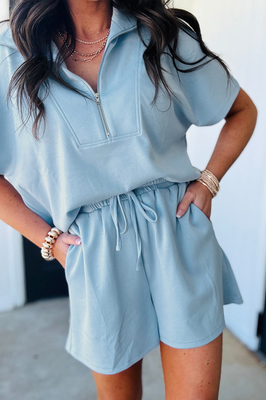 Dear-Lover blue two-piece set with half-zip short sleeve sweatshirt and shorts, made of polyester, viscose, and elastane for a loose fit.