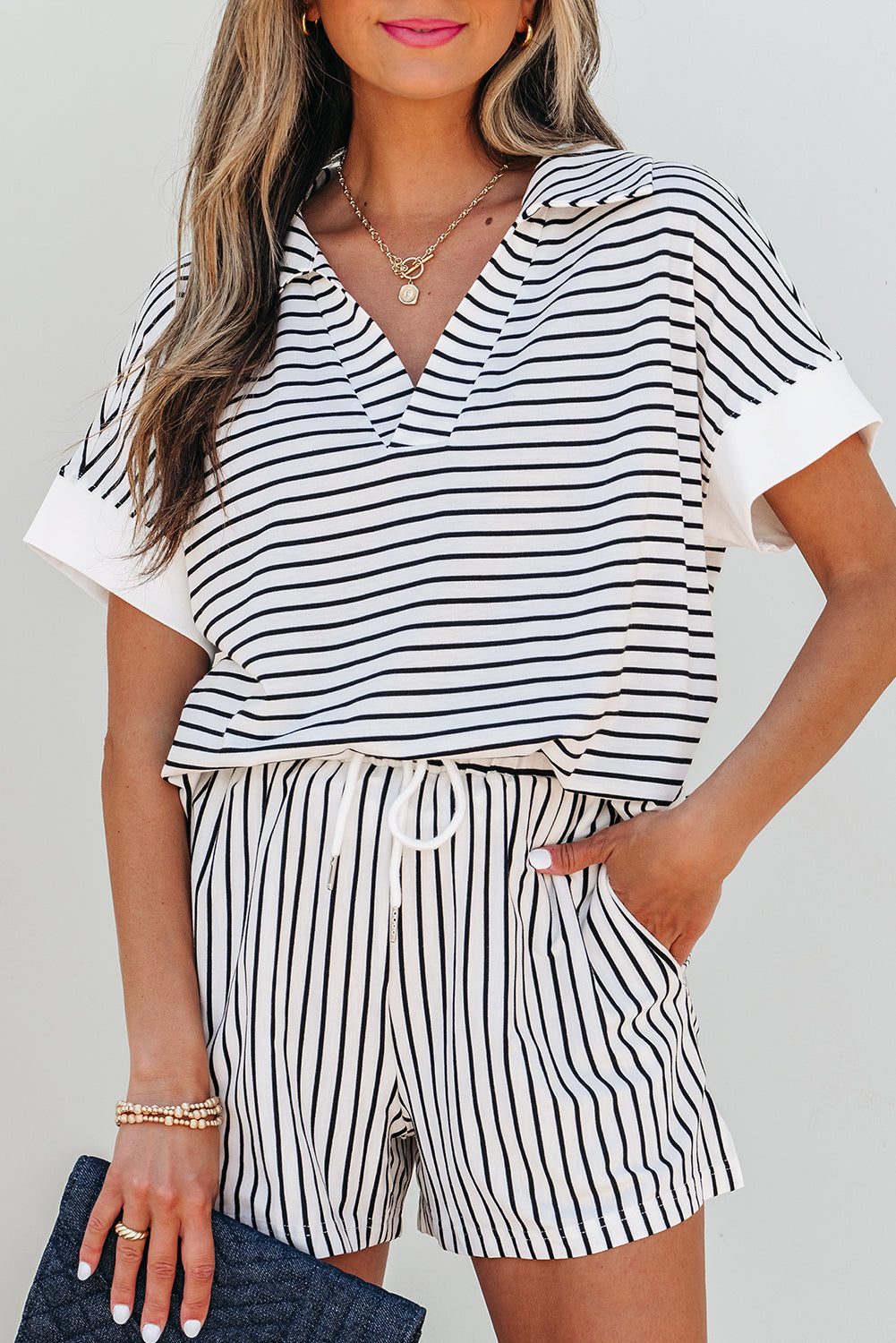 Black stripe V-neck tee and casual shorts set by Dear-Lover, featuring a comfortable two-piece design in polyester and viscose fabric.