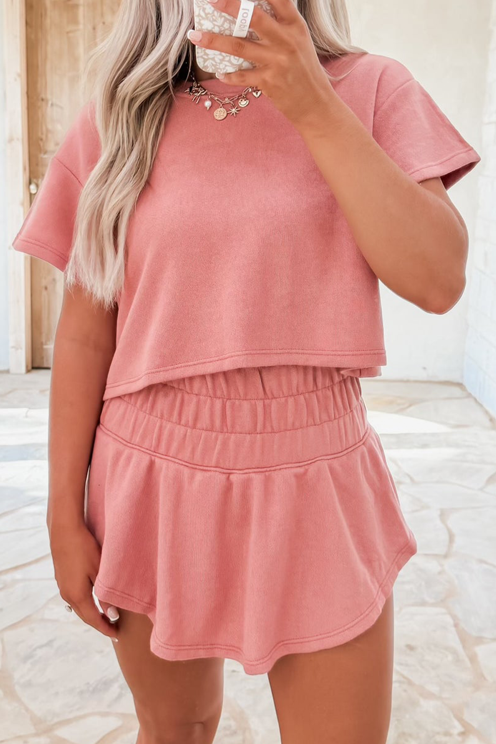 Dear-Lover Blossom 2-piece cropped tee and ruffle high waist skort set, featuring floral design, polyester-cotton blend, stylish and comfortable.
