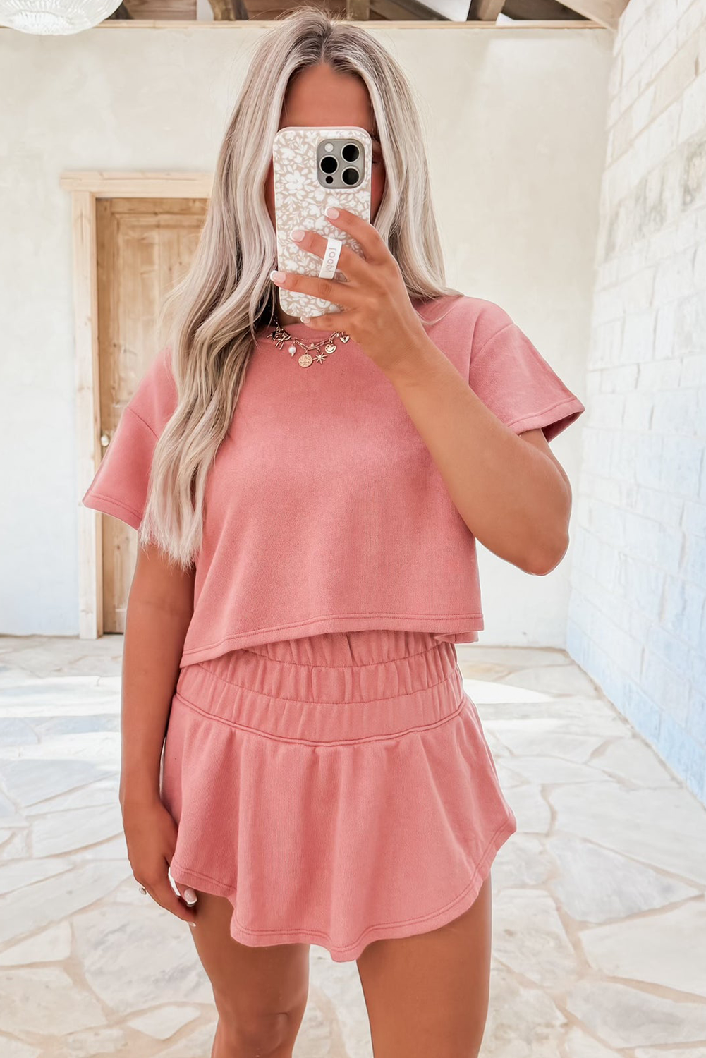 Dear-Lover Blossom 2-piece crop top and ruffle high-waist skort set, made of polyester, cotton, and elastane, stylish and comfortable.