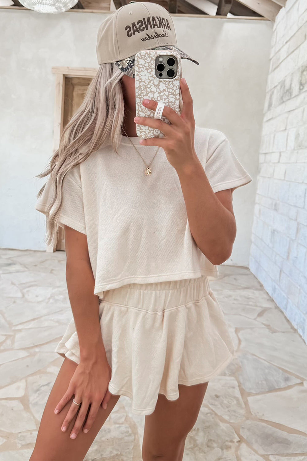 Dear-Lover Blossom 2-piece cropped tee and ruffle high-waist skort set, showing the floral print and stylish design.