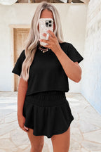 Dear-Lover Blossom 2-piece cropped tee and ruffle high-waist skort set, featuring floral print and comfortable fabric blend.
