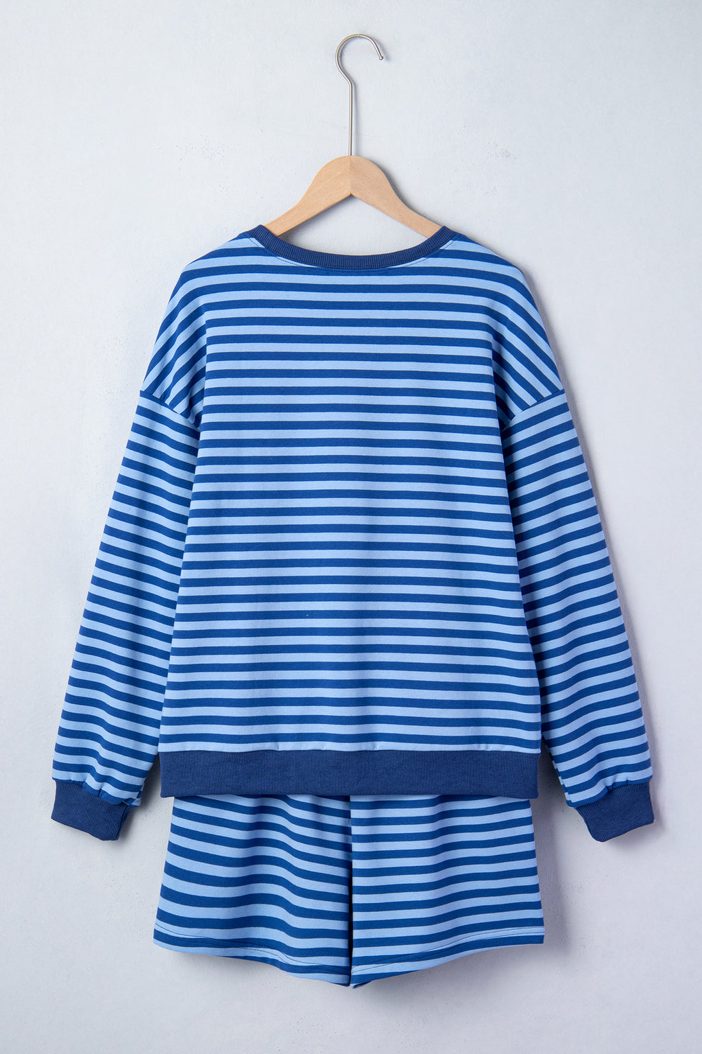 Blue stripe two-piece casual set with drop shoulder long sleeve pullover and elastic waist shorts, made of cotton and elastane.