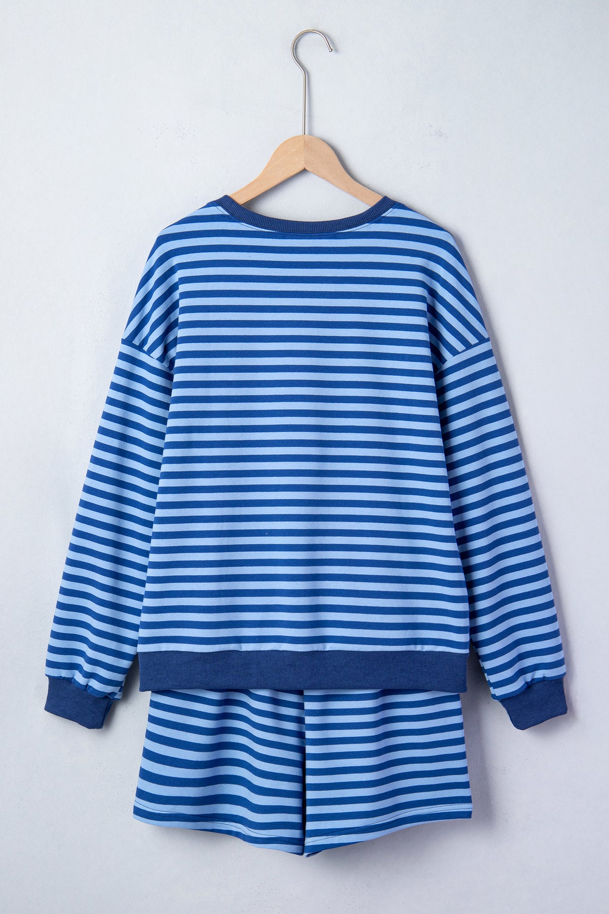 Blue stripe two-piece casual set with drop shoulder long sleeve pullover and elastic waist shorts, made of cotton and elastane.
