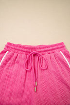 Bright pink textured color block trim loose tee and drawstring shorts two-piece set by Dear-Lover Dropshipping, casual summer outfit.