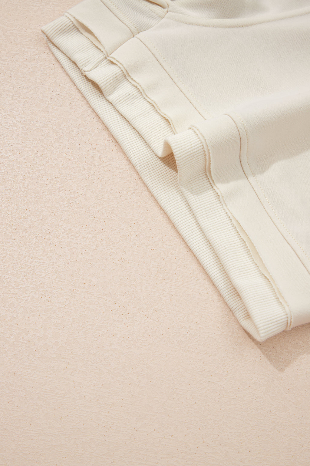 Dear-Lover Jet Stream solid color two-piece short set with contrast textured patchwork and raw edges, made of polyester and cotton blend.