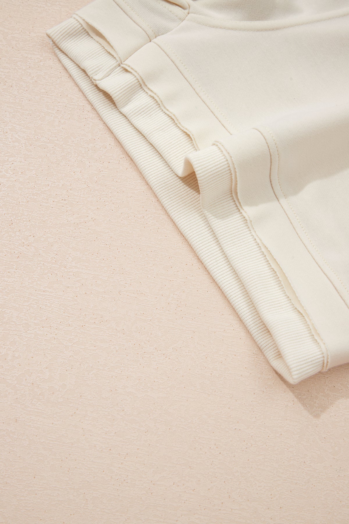 Dear-Lover Jet Stream solid color two-piece short set with contrast textured patchwork and raw edges, made of polyester and cotton blend.