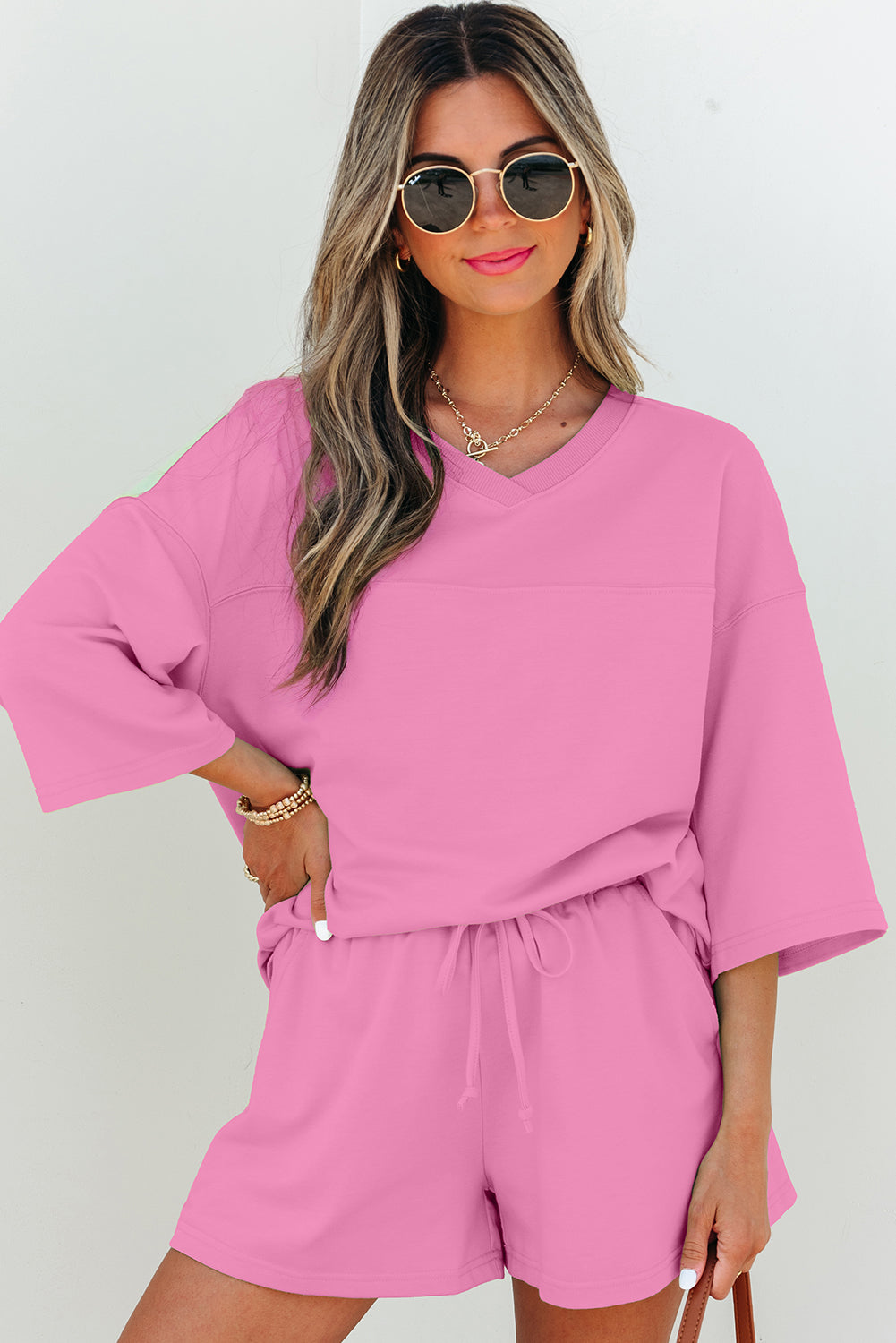 Dear-Lover Meadow Mist Green two-piece set with loose V-neck half-sleeve tee and matching shorts, made of polyester, cotton, and elastane.