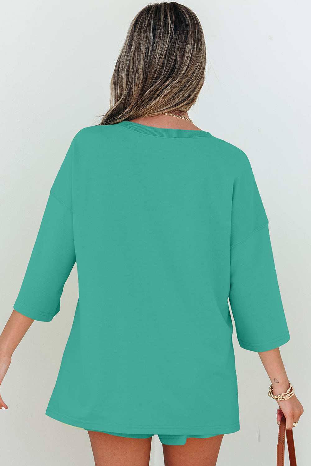 Meadow Mist Green solid loose V-neck half-sleeve tee and matching shorts, Dear-Lover two-piece set in polyester, cotton, elastane blend.