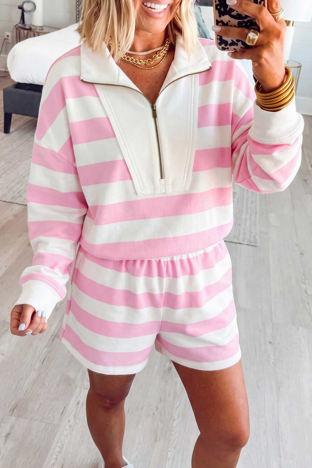 Pink stripe patchwork zipper pullover and elastic waist shorts set for women, made of cotton and elastane, two-piece casual outfit.