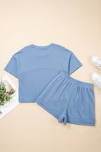 Sky blue solid color two-piece short set with textured patchwork and raw edges, made of polyester and cotton, by Dear-Lover.