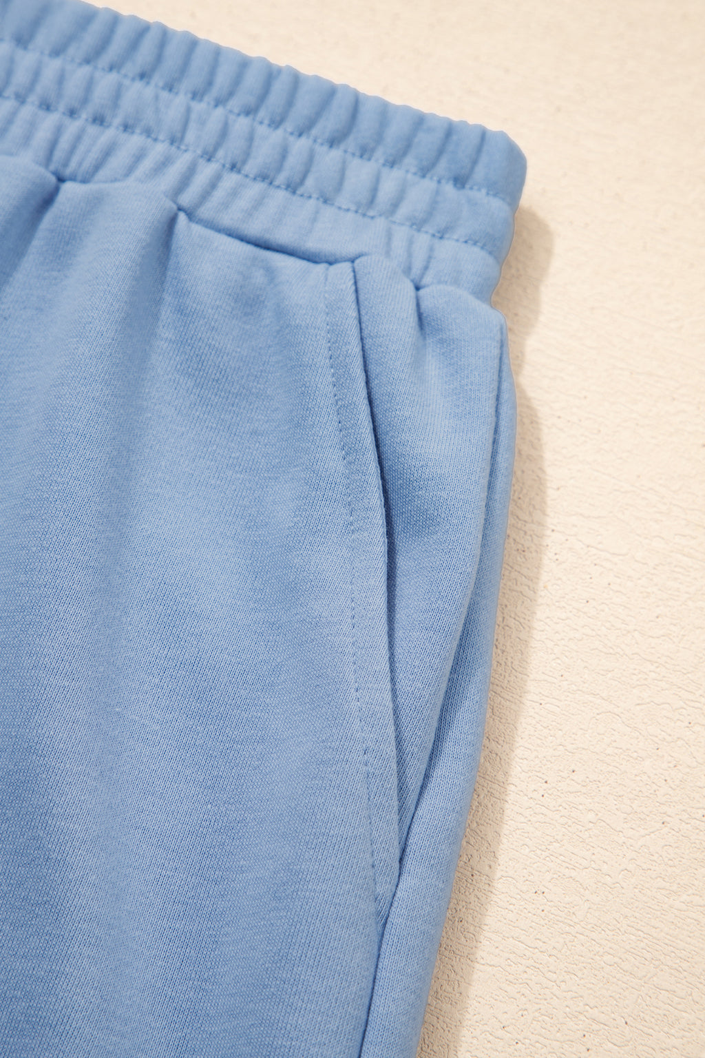 Sky blue solid color two-piece short set by Dear-Lover with contrast textured patchwork and raw edges, made of polyester and cotton.