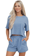 Sky blue solid color two-piece short set by Dear-Lover with contrast textured patchwork and raw edges, made of polyester and cotton.