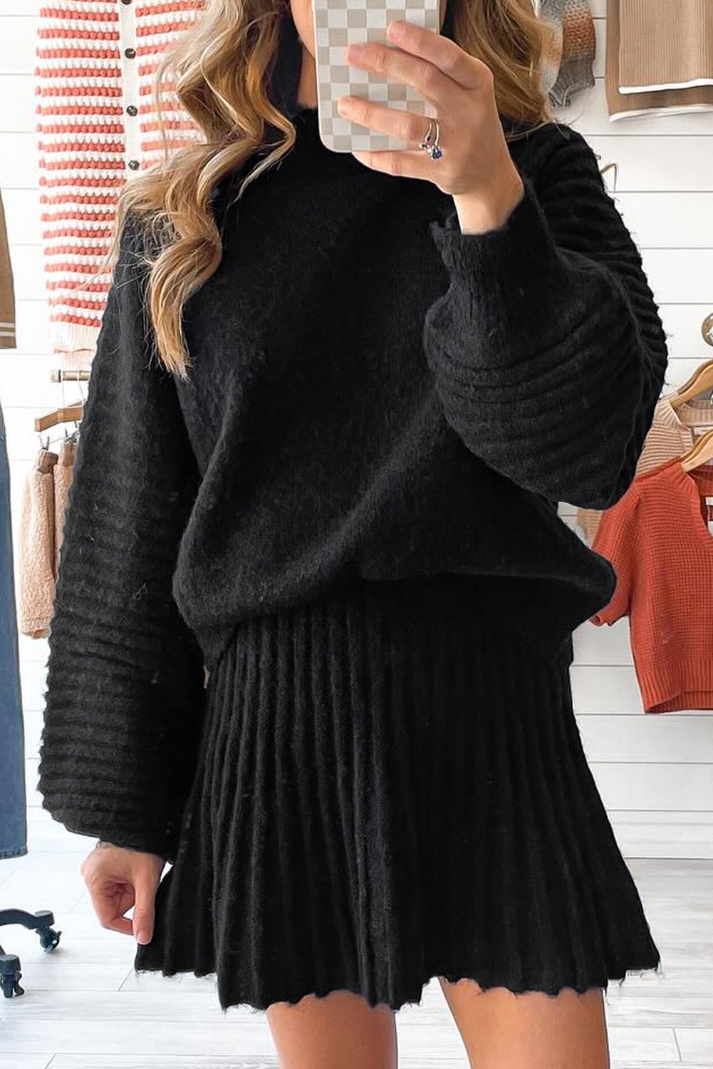 Black two-piece knitted outfit with high neck puff sleeve sweater and pleated mini skirt from Dear-Lover Dropshipping.