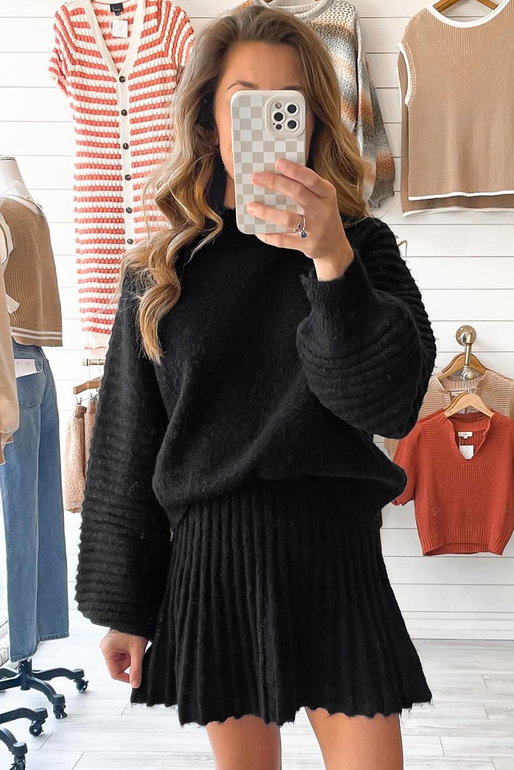 Black Dear-Lover two-piece knitted outfit with high neck puff sleeve sweater and pleated mini skirt, stylish and cozy ensemble.