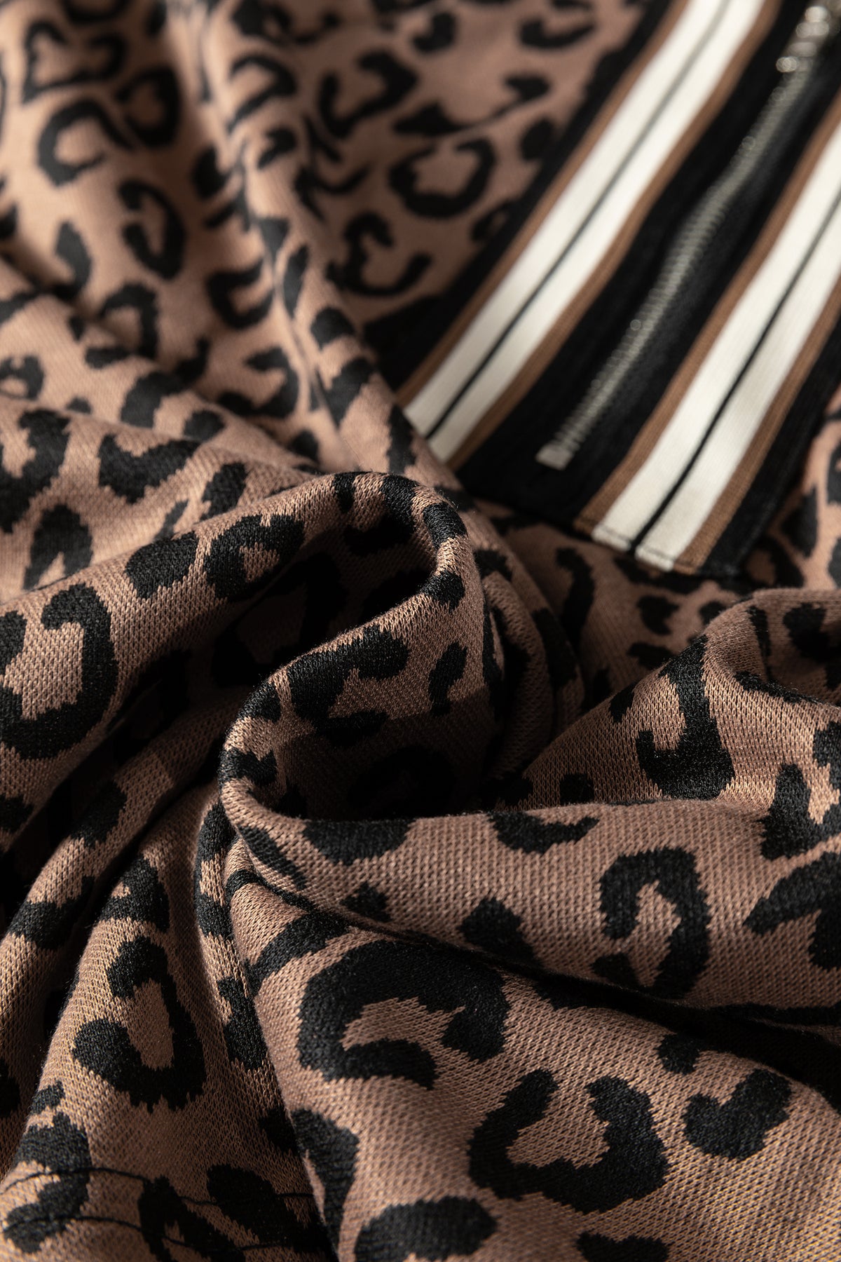 Khaki leopard print quarter zip long sleeve top with matching mini skirt set by Dear-Lover, made of polyester and elastane.