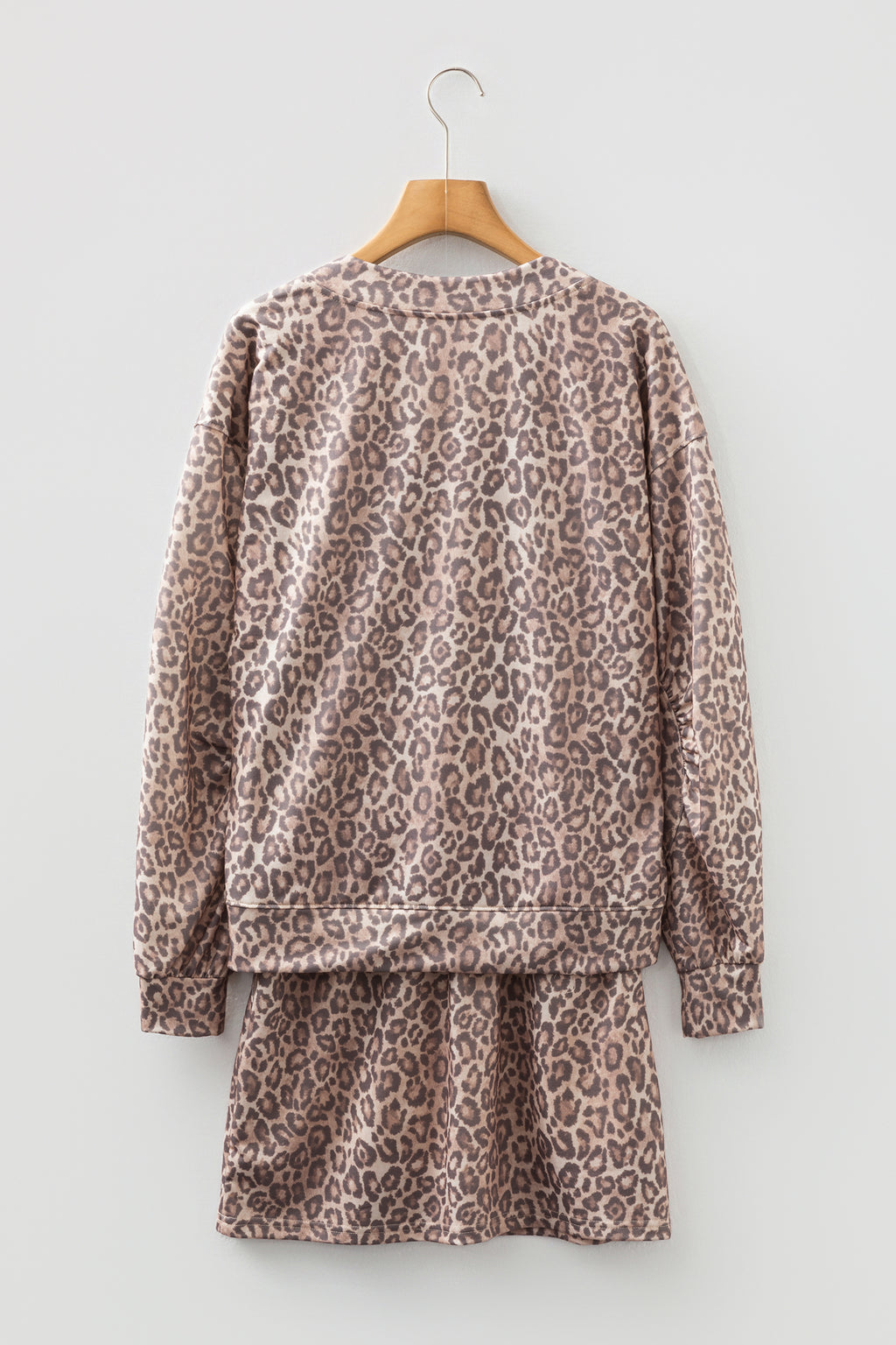 Light French beige leopard print two-piece set with V-neck pullover and mini skirt from Dear-Lover, made of polyester and elastane.