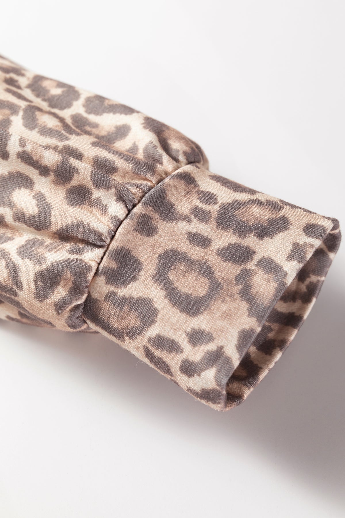 Light French beige leopard print two-piece set featuring a V-neck pullover and mini skirt from Dear-Lover Dropshipping.