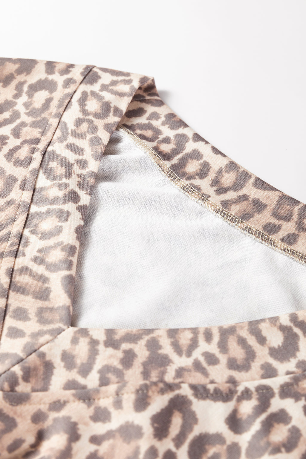 Light French beige leopard print two-piece set with V-neck pullover and mini skirt from Dear-Lover, stylish and comfortable for casual wear.