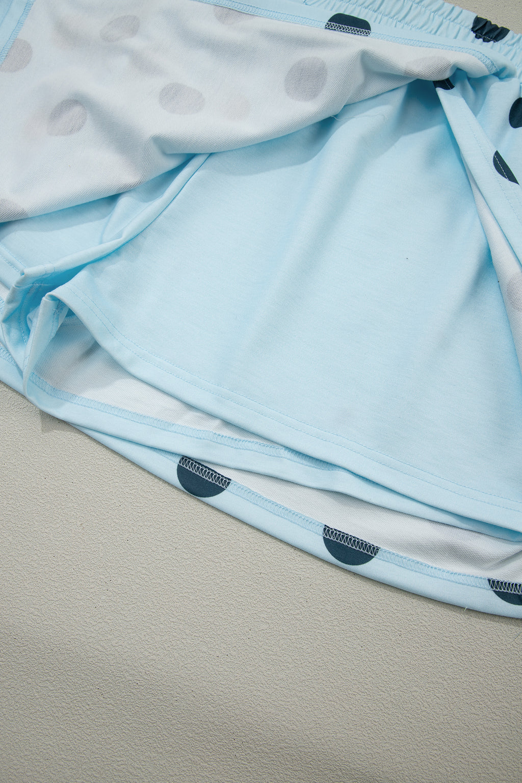 Sky blue ribbed trim polka dot print tank and split mini skort two-piece set by Dear-Lover, featuring lightweight polyester and elastane fabric.