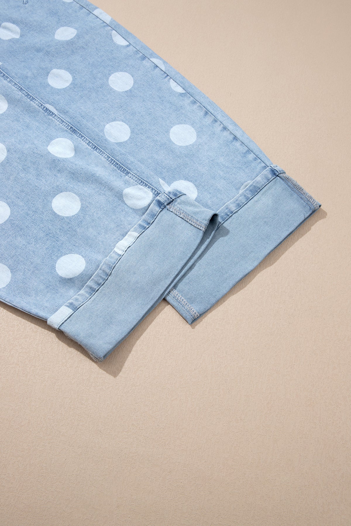 Polka dot ankle-length casual jeans with metal buttons from Dear-Lover, showing the denim fabric and button details.