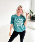 Women’s Ice Teal “It's Fine, I’m Fine” graphic T-shirt by Envy Stylz Wholesale, casual women’s apparel shirt with bold print.