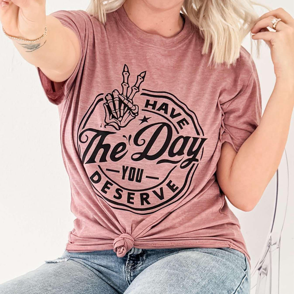 Mauve Have The Day You Deserve graphic T-shirt for women by Envy Stylz Wholesale, casual apparel with bold text design.