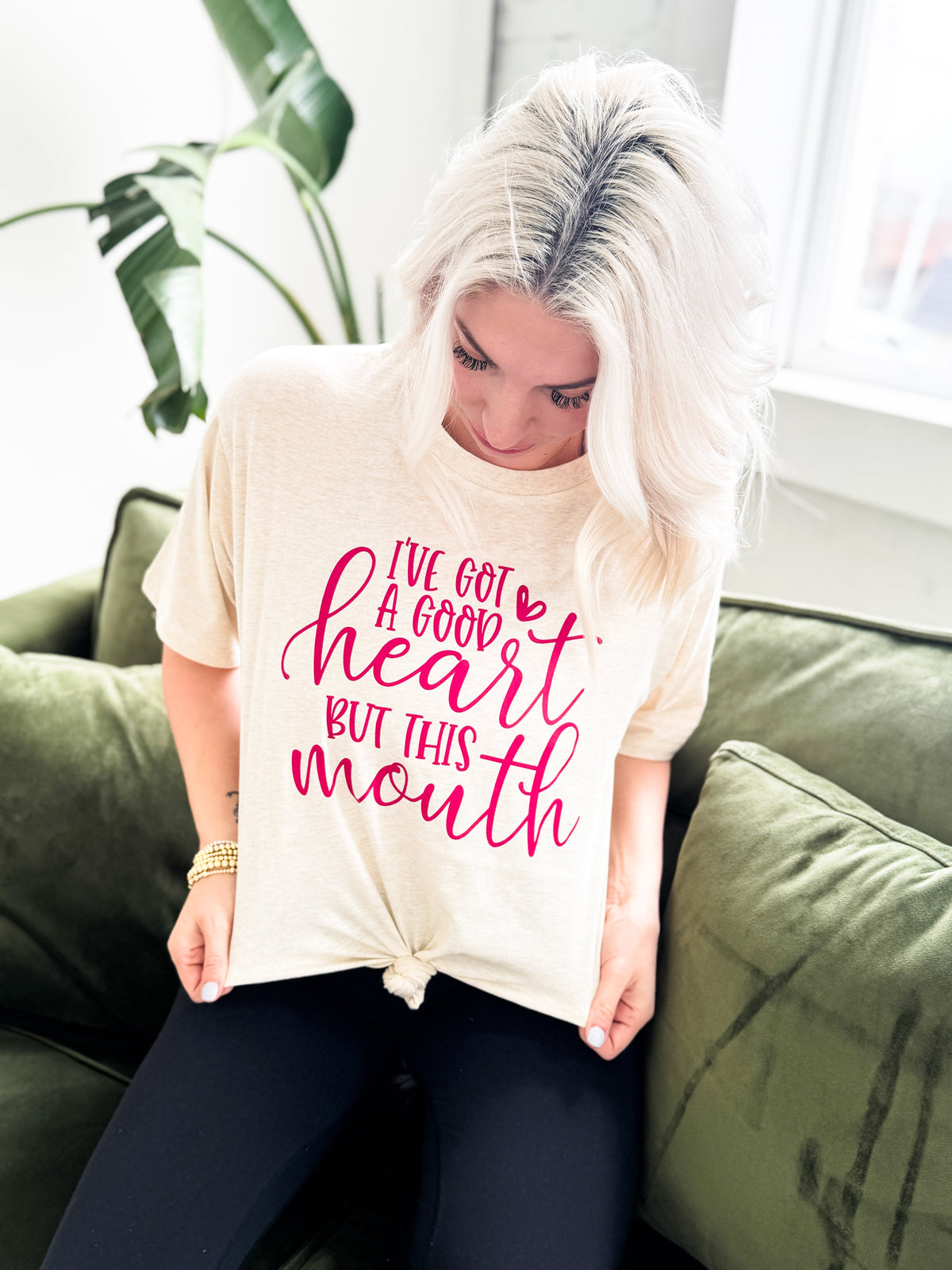 Oatmeal graphic T-shirt for women featuring bold "I've Got a Good Heart But This Mouth" design from Envy Stylz Wholesale
