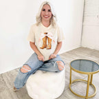 Women’s pink bow graphic T-shirt featuring western boots from Envy Stylz Wholesale, casual women's apparel and t-shirt.