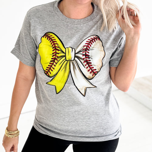 Heather grey women's Baseball/Softball Bow Graphic Tee by Envy Stylz Wholesale, featuring a sporty bow design on a casual t-shirt.