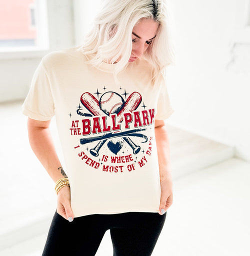 Women’s graphic T-shirt by Envy Stylz Wholesale, featuring “At The Ballpark Is Where I Spend Most Of My Days” design.