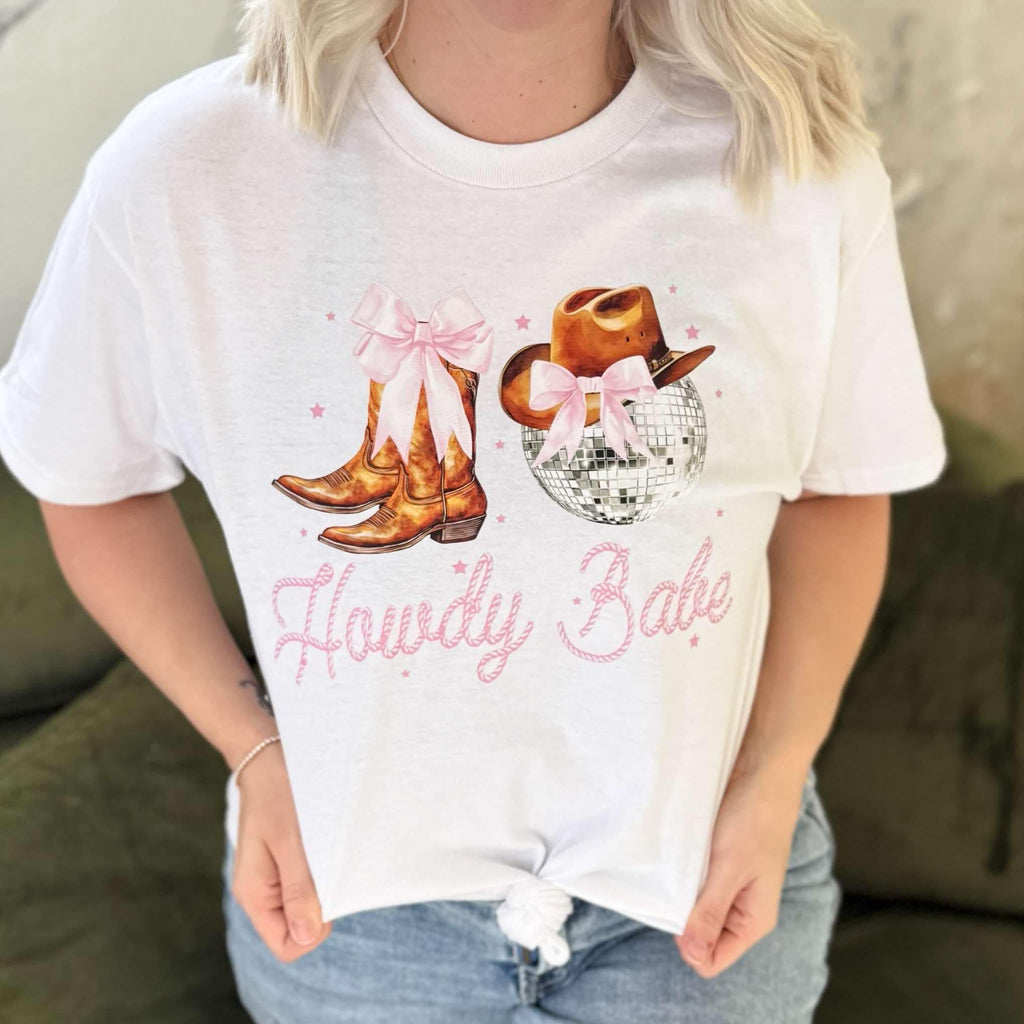 White women's Howdy Babe graphic T-shirt by Envy Stylz Wholesale featuring a fun, casual design on a comfortable T-shirt.