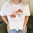 White women's Howdy Babe graphic T-shirt by Envy Stylz Wholesale featuring a fun, casual design on a comfortable T-shirt.