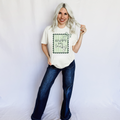 Women’s ivory Happy Go Lucky graphic T-shirt by FestiviTees, casual crew neck shirt with cheerful design.