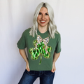 Light green women's T-shirt with a paintstroke shamrock graphic from FestiviTees, casual apparel for a stylish, artistic look.