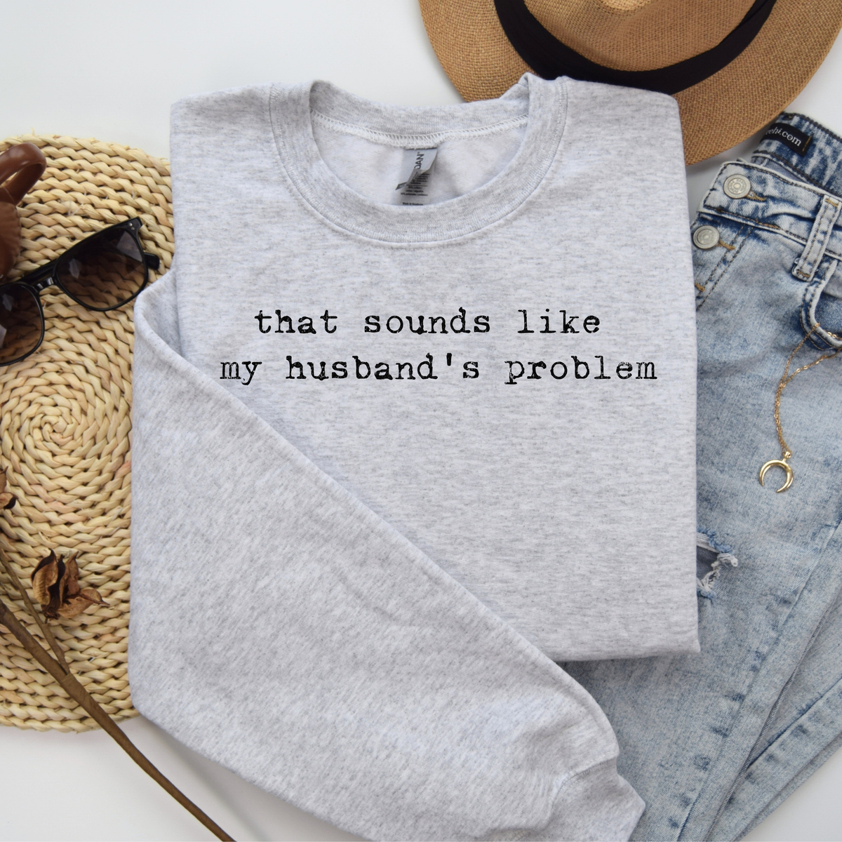 Women's Gildan ash T-shirt with humorous "Sounds Like My Husband's Sweatshirt" graphic by FestiviTees.