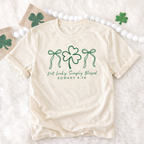 Women's FestiviTees graphic T-shirt featuring "Not Lucky, Simply Blessed" design on Gildan fabric.